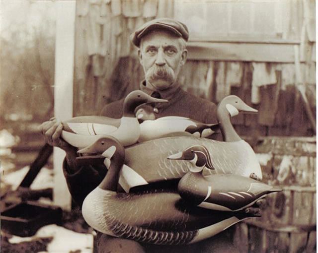 Man Holding Wood Duck Decoys